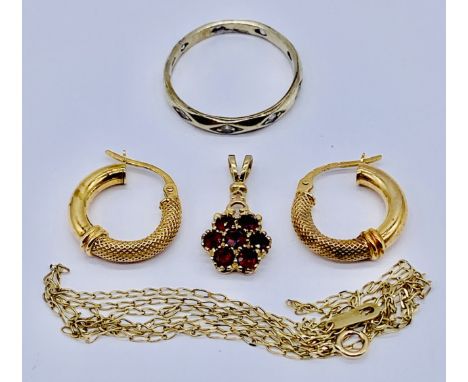 A 9ct white gold eternity ring along with a pair of 9ct gold earrings and 9ct fine necklace with garnet pendant , total weigh