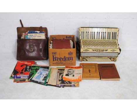 A Settimio Soprano Three accordion, along with a large collection of various sheet music