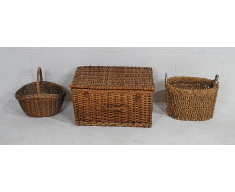 A vintage wicker picnic hamper, metal framed basket and another.