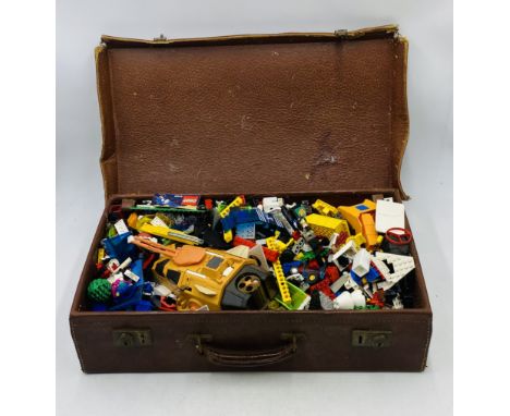 A collection of vintage Lego, storage in a leather suitcase