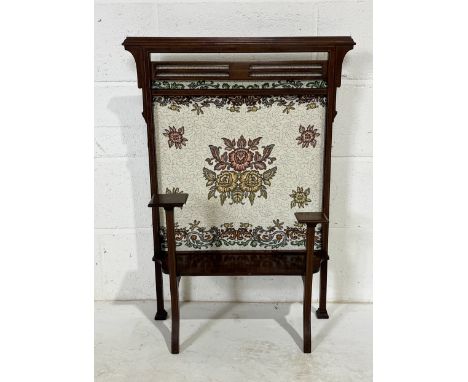 An Edwardian fire screen with inlaid detail and tapestry back