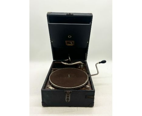 A vintage HMV - "His Masters Voice" Gramophone along with an assortment of "78" records