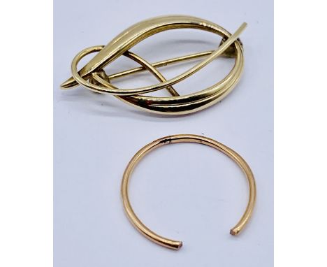 A 9ct gold brooch (1.6g) along with a tested scrap 18ct gold ring (0.7g)
