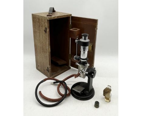 A Bellingham & Stanley Microscope in case with some accessories 