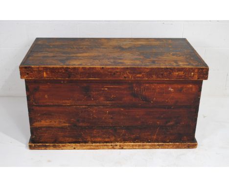 A large antique pine trunk, with wrought iron handles - length 119cm, depth 63.5cm, height 62cm