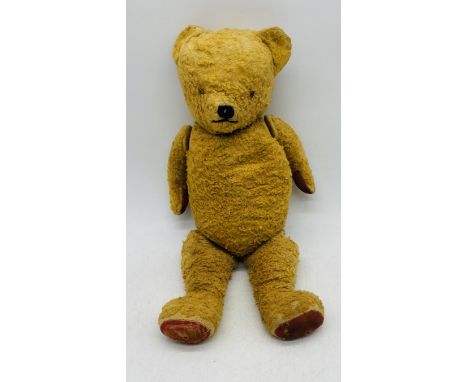 A large vintage teddy bear - height 65cm