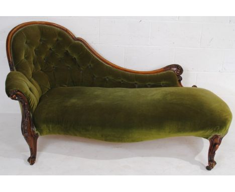 A Victorian chaise longue, with button-back detailing, raised on French cabriole legs with carved decoration - length 170cm