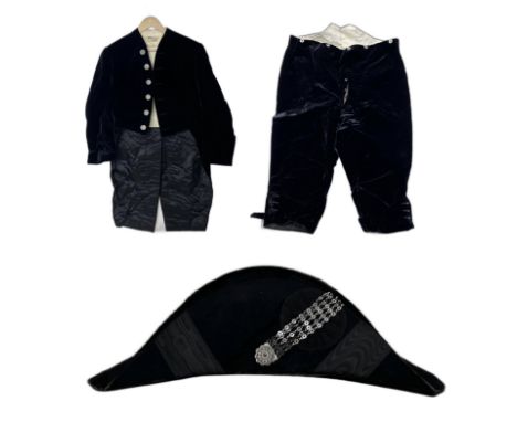 A Victorian Court Dress ensemble by Henry Poole & Co, Saville Row, London comprising of a dark blue velvet tailcoat and breec