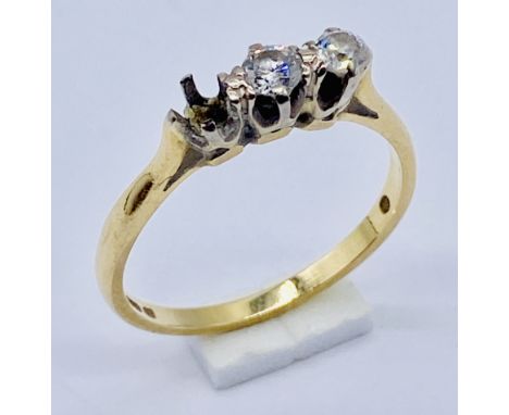 An 18ct gold ring set with diamonds- one stone missing, total weight 2.3g, size M 1/2