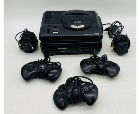 An unboxed 16-Bit Sega Mega Drive games console with Sega Mega CD attached, along with three controllers, power cable etc