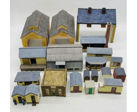 A collection of well-built model railway O gauge buildings including engine sheds, office building, ground frame building, to