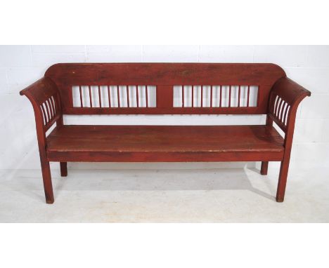 A Hungarian red painted wooden bench