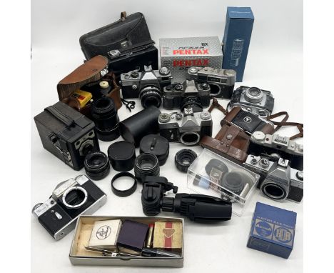 A collection of various vintage cameras and equipment