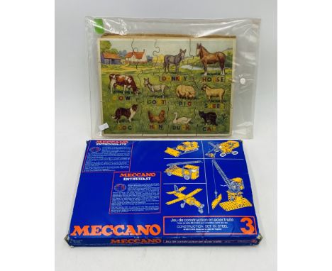 A boxed Meccano Enthusiast No 3 set, along with a vintage wooden farm animal jig-saw puzzle