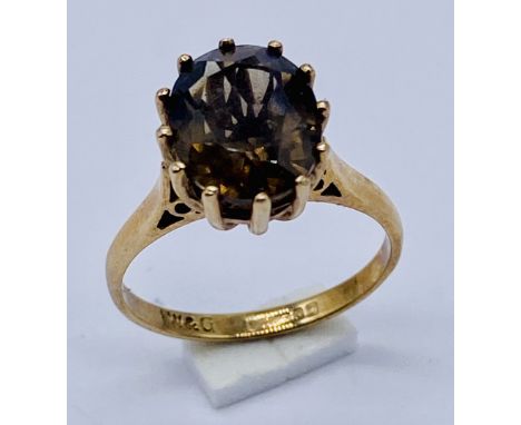 A 9ct gold ring set with a smoky quartz, size K 1/2