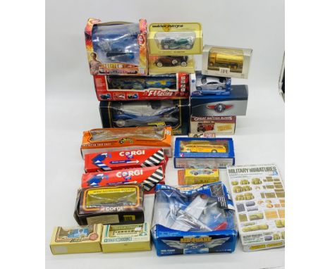 A collection of various boxed die-cast vehicles including Burago Alfa Romeo, Atlas Edition Great British Bus, Corgi, Lledo Da
