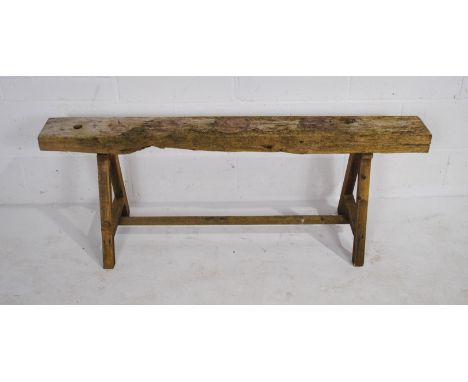 A weathered wooden garden bench - length 133cm, height 51cm
