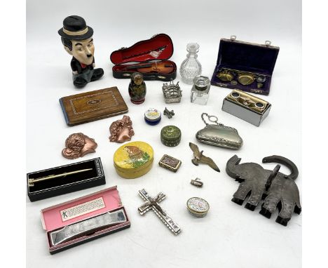 A collection of various items including enamel pill pots, elephant shaped padlock, scales etc.