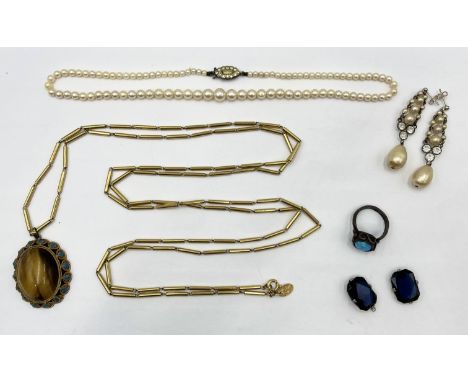 An enamelled silver pendant set with tiger's eye on a gold plated Vendome long guard chain, a set of pearls on Sterling silve