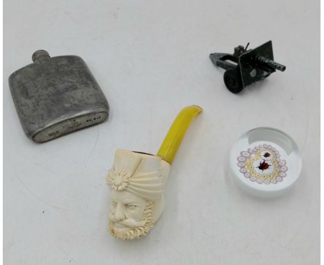 A Caithness ladybird paperweight, a meerschaum carved pipe, 4oz hipflask, and a toy artillery carriage gun. 