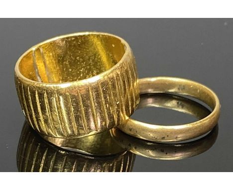 LADY'S &amp; GENT'S 22CT GOLD RINGS (2) - to include a fully ribbed wide band example, London mark but date letter obscured, 