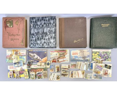 VINTAGE POSTCARDS to include three albums of UK, tea card albums and memorial cards. Also, a vintage postcard album and a mix