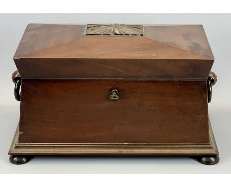 A REGENCY MAHOGANY SARCOPHAGUS FORM TEA CADDY with wing side handles, lift-up lid with plush lined interior fitted with two c