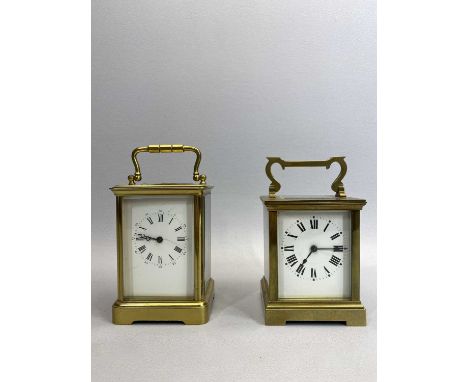 A GILDED BRASS CASED CARRIAGE CLOCK - white enamelled dial with black Roman numerals, eight day movement striking on a gong, 