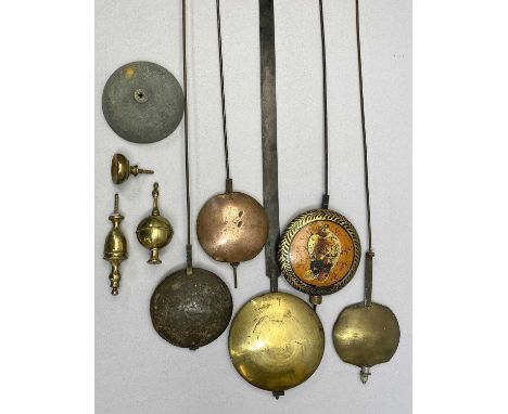 LONGCASE CLOCK PENDULUMS (5) - with lead filled bobs, a cast metal clock bell, 10.5cms diameter and three gilded brass clock 