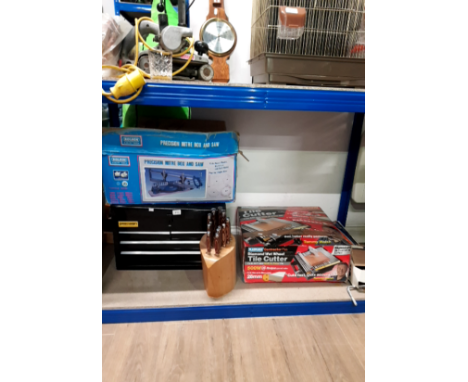 A BOXED TILE CUTTER A SCISSOR JACK PRECISION MITRE BOX AND SAW AND A METAL TOOLBOX ETC