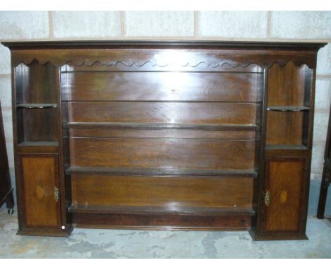 A George III Oak and Mahogany Inlaid Enclosed Plate Rack.
With a cavetto cornice above an inlaid and shaped fret cut frieze w