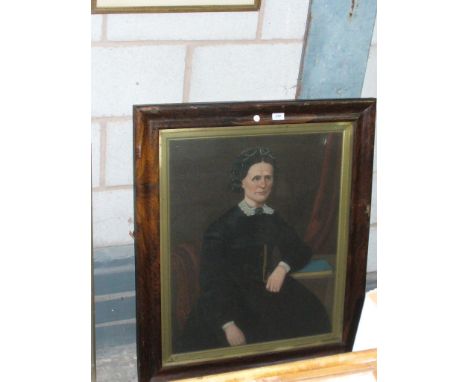 A Victorian portrait of a woman , oil on canvas within a rosewood frame.