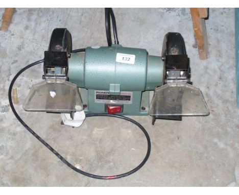 A Rondy 151 electric bench grinder.