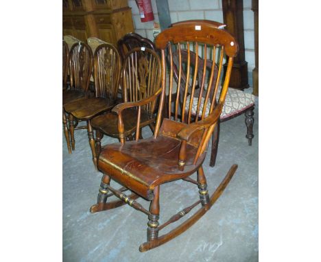 An American stained pine comb back rocking chair.