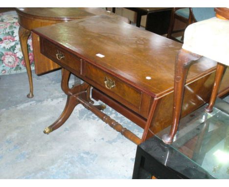 A Reproduction burr walnut sofa table with 2 frieze drawers.