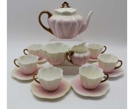 A C.1900 WHILEMAN & CO. (Pre Shelley) TEA SET FOR SIX PERSONS, in shaded pink with gilt handlesCondition report:  A crack to 