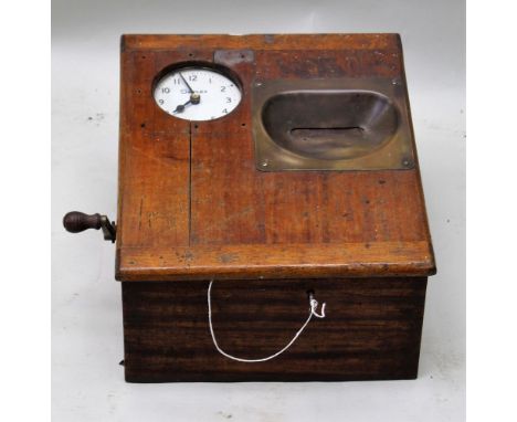 AN EARLY 20TH CENTURY MAHOGANY CASED CLOCKING IN MACHINE by G B T R Ltd, having a Simplex branded clock face, the mechanism n