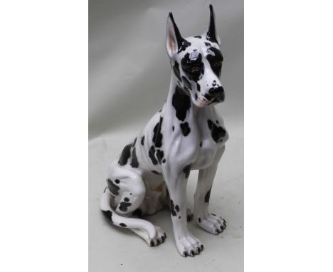 AN 82cm HIGH BLACK &amp; WHITE GLAZED CERAMIC MODEL OF A SEATED GREAT DANE, 82cm (to tip of ear)