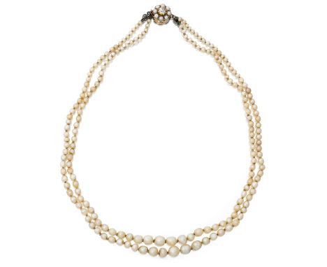 A two row natural pearl necklace, two rows of graduated natural pearls, strung knotted, to a gold old-cut diamond and half-pe