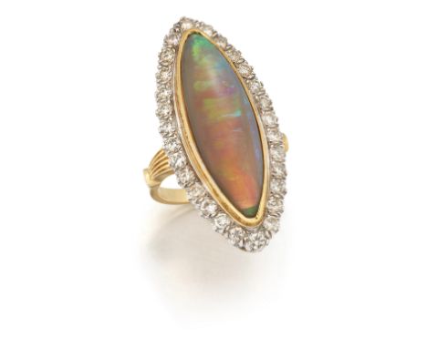 An 18ct gold opal and diamond cluster ring, the marquise shaped cabochon opal to surround of brilliant-cut diamonds, London h