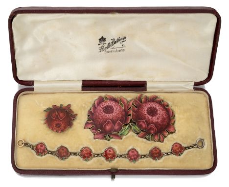 A rare Australian silver gilt enamelled waratah flower suite, retailed by Flavelle Bros Ltd, comprising a buckle, a brooch an