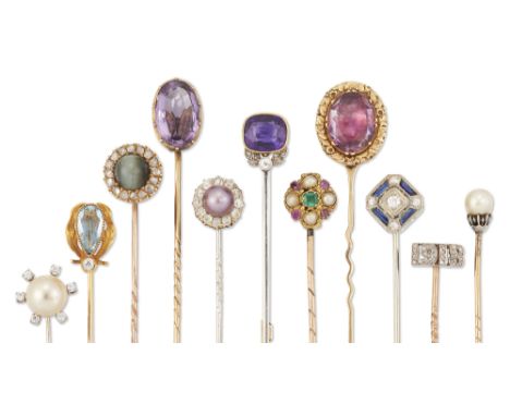 A group of eleven stickpins, comprising: an Art Nouveau pear-shaped aquamarine and old brilliant-cut diamond-set stickpin; a 