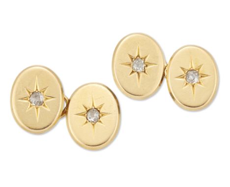 A pair of late Victorian, diamond-set star motif cufflinks, each oval panel designed with a central old brilliant-cut diamond