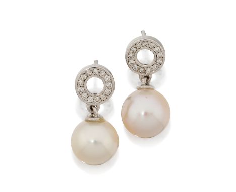 A pair of cultured freshwater pearl and diamond earrings, the cultured freshwater pearl surmounted by a brilliant-cut diamond