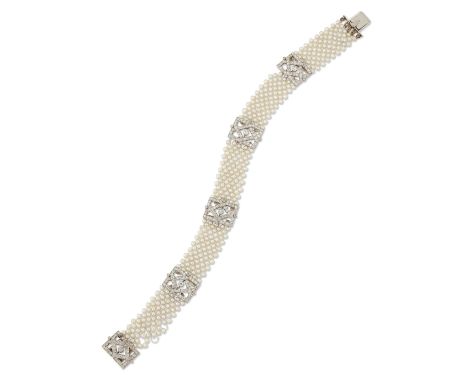 A Belle Époque diamond and seed pearl bracelet, the seed pearls strung on silk thread and arranged in a lattice design to fiv