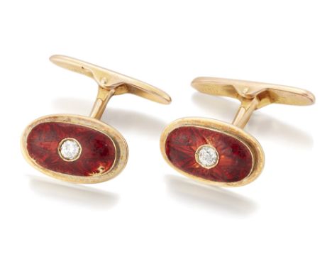 A pair of diamond and enamel cufflinks, the oval panels with a brilliant-cut diamond set to the centre, to a red guilloché en