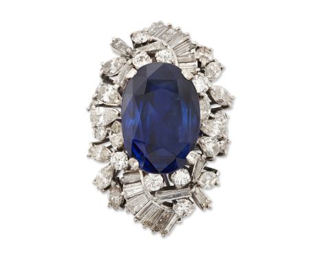 A sapphire and diamond pendant, claw set with an oval mixed-cut sapphire, weighing  24.13 carats, framed with graduated bague