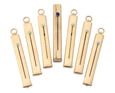 A group of six 18ct gold and one 9ct gold mounted extending pencils, each of oval tubular design with turquoise and one blue 