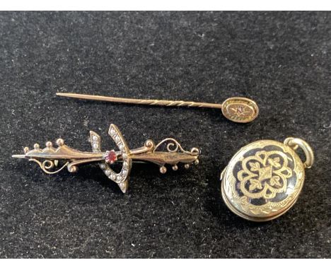 A 9ct gold stick pin and a 9ct gold brooch (gross weight 3.37g) with a yellow metal mourning locket 