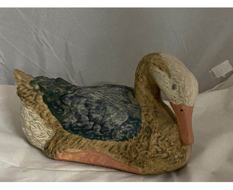 A hand made Shelf pottery duck figure. 